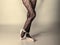 Female legs dancer in ballet shoes