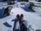 Female legs in hiking boots in snow on High Tatras mountains. Happy adventures in travel.