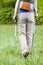 Female legs and nordic walking poles