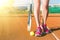 Female legs with tennis racket