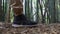 Female Legs in Trekking Shoes Hiking in Bamboo Forest. Close Side View