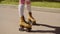 Female Legs On Vintage Roller Skater On The Road.