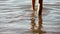 Female legs in water