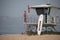 A female lifeguard at Ventura Harbor stands watch from a lifeguard tower