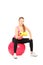 Female lifting up a dumbbell seated on a ball