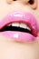 Female lips with bright pink lipstick