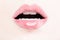 Female Lips with Pink Lip Gloss. Wet Lips with Makeup