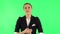 Female listens attentively and nods his head pointing finger at viewer. Green screen