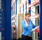 Female logistics employee on the phone and checking inventory