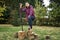 Female lumberjack holding a big hand saw