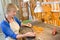 female luthier working on creation violin