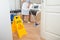 Female maid cleaning floor