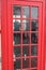 Female making a call in the British Red PhoneBox