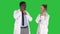 Female and male doctor using mobile phones making calls telling happy news on a Green Screen, Chroma Key.