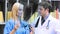 Female and male doctors examining an xray in hospital footage