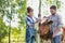 Female and male farmers checking on their cows on their farm