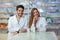 Female and male pharmacists in pharmacy