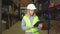 Female manager looking on clipboard during stock inventory