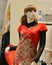 Female mannequin Dressed in red Chinese traditional clothing With phoenix pattern in a clothing store