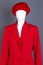 Female mannequin in red beret and jacket.