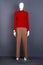 Female mannequin in red sweater and trousers.