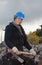 Female manual worker in blue hard hat