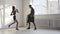 Female martial arts fighter practicing with trainer, punching taekwondo kick pad exercise kicking. Training of kickboxer
