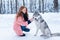 Female master on dog training with siberian husky