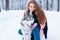 Female master on dog training with siberian husky