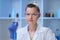 A female medical scientist works in a laboratory. Spcialist conducts experiments, develops auccin auctin from the virus