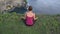 Female in meditation. Yoga woman. Lotus pose. Back view.