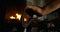 Female metalsmith heating horseshoe in fire 4k