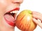 Female model biting an apple