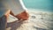 A Female Model is Sunbathing on the White Beach of the Tropical Sea, Sitting Down on the Sand