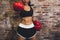 Female muscular sport boxer with boxing gloves posing over wall