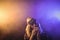 Female musician playing harmonica in nightclub