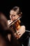 Female musician playing on violin on