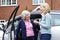 Female Neighbor Giving Senior Woman A Lift In Car