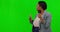 Female news reporter, microphone and green screen in studio broadcast, face and action news by background. Black woman