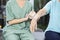 Female Nurse Putting Crepe Bandage On Senior Woman\'s Hand