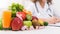 Female nutritionist doctor writing vegetable diet plan