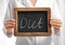 Female nutritionist holding small blackboard with word DIET on light background, closeup