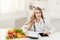 Female nutritionist working on digital tablet