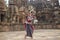 Female Odissi Dancer wears traditional costume with hand mudra at Mukteshvara Temple, bhubaneswar