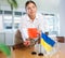 Female office coordinator setting flags of Ukraine and Bahrain on negotiating table