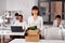 Female office worker with box of personal stuff