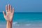 Female open hand on sea background