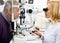 Female ophthalmic doctor check eyes man in eye clinic