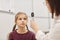 Female Ophthalmologist Examining Little Girl in Clinic