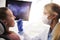 Female orthodontist using dental mirror during checkup